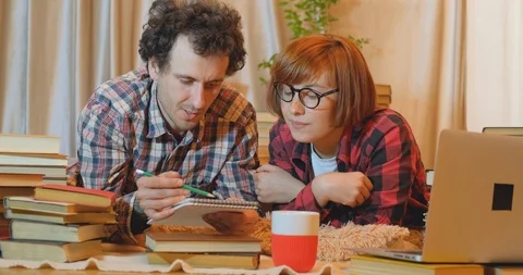 Couple of students with books Stock Footage 127037880