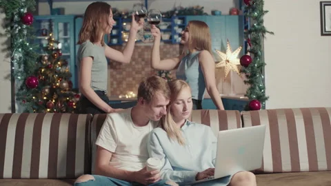 Couple Students Study While Friends Drink Wine Have Fun Celebrate Christmas. Stock-Footage 142659141