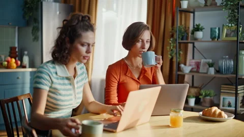 Couple students studying remote sitting kitchen at domestic breakfast closeup. Stock Footage 333777353
