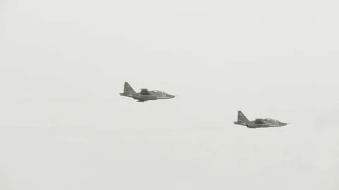 Couple of Su-25 fly by Stock Footage 72921107