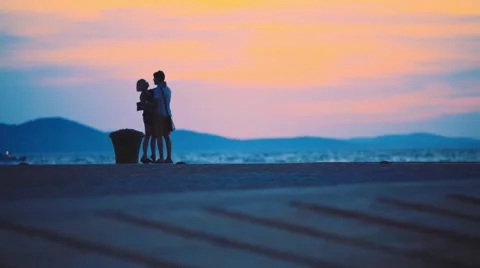 Couple at sunset on the beach Stock Footage 66908865