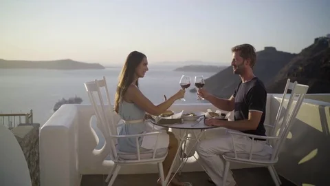 Couple sunset dinner red wine cheers Stock Footage 80234276