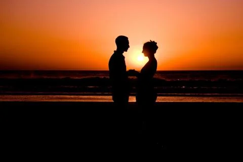 Couple in sunset Stock Photos