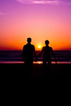 Couple in sunset Stock Photos