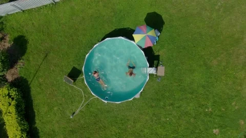 Couple swimming against current in frame pool Stock Footage 329276878