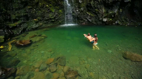 Couple Swims To Waterfall Stock Footage 52994487