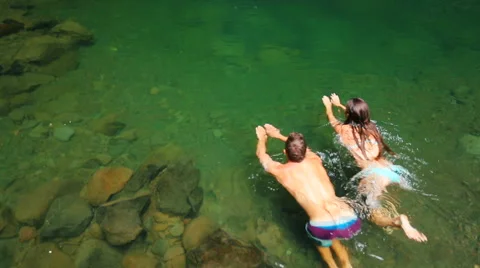 Couple Swims To Waterfall Stock Footage 52994850