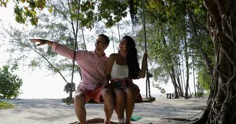 Couple On Swing, Guy Point Finger Aside, Man And Woman Talking Communication Stock Footage