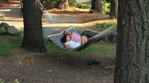 COUPLE SWING IN A HAMMOCK Video stock 28837263