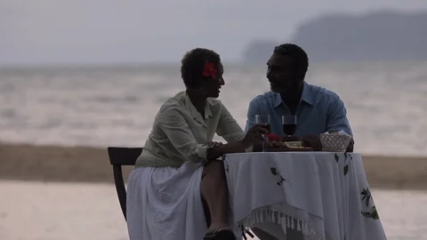 Couple at a table by the sea. 스톡 동영상 88369545