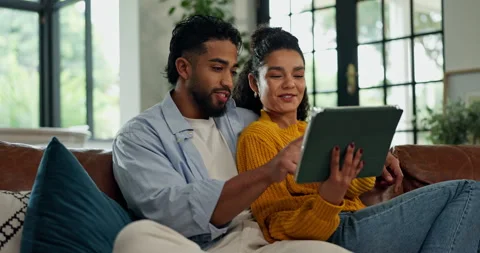 Couple, tablet and relax on sofa with Stock Video Pond5