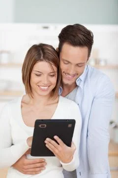 Couple with tablet Stock Photos