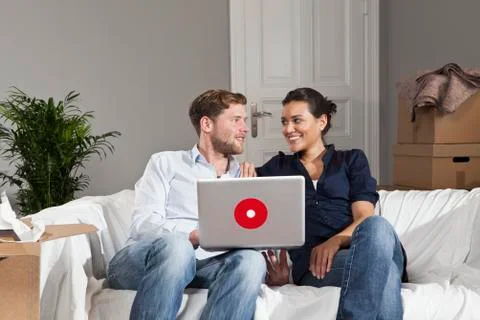 A couple taking a break from moving Stock Photos