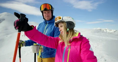 Couple Taking A Break From Skiing To Enjoy View Stock Footage 140192840