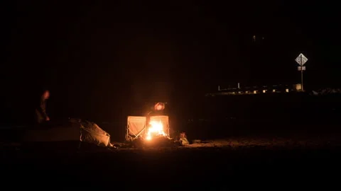 Couple Taking Down Tent - Night Campfire Ocean Beach Timelapse Stock-Footage 183216352