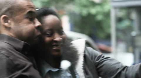 Couple taking a self portrait in a coffee shop Stock Footage 43116895