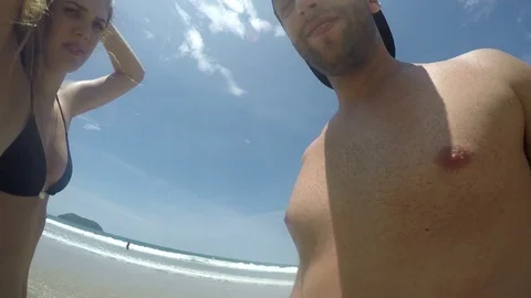 Couple taking a selfie and having fun in a Beach in Brazil Stock Footage 71277225