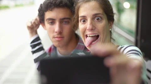 Couple taking selfie and making funny faces Stock Footage 63286162
