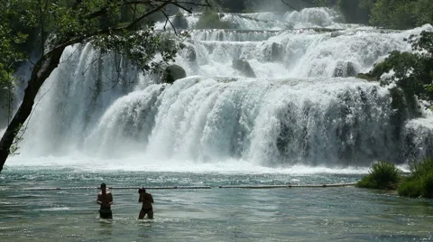 Couple taking selfie below waterfall Krka river Stock Footage 50542496