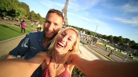 Couple taking selfie at the Eiffel tower, Paris Stock Footage 75996102