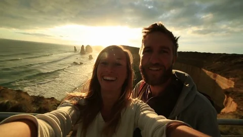 Couple taking selfie on the Great Ocean Road in Australia at sunset  76345782
