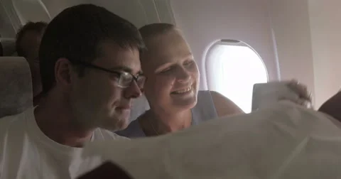 Couple Taking Selfie in the Plane Stock-Footage 52373291