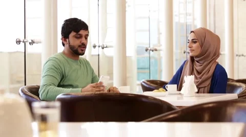 Couple taking selfie using mobile camera at restaurant. Stock Footage 57337770