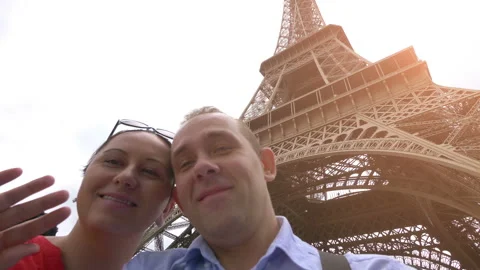 Couple taking selfie with view of Eiffel Tower in Paris in 4k slow motion 60fps Stock Footage 109427134