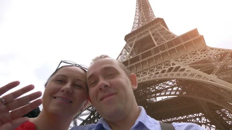 Couple taking selfie with view of Eiffel Tower in Paris in 4k slow motion 60fps Stock Footage 109427272