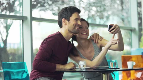 Couple taking selfies with smartphone Stock Footage 63294965