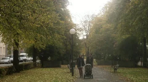 A couple taking a walk with their son Stock Footage 11289623