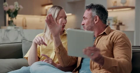 Couple, talk and planning in house with tablet, research interior design and Stock Footage 338030372