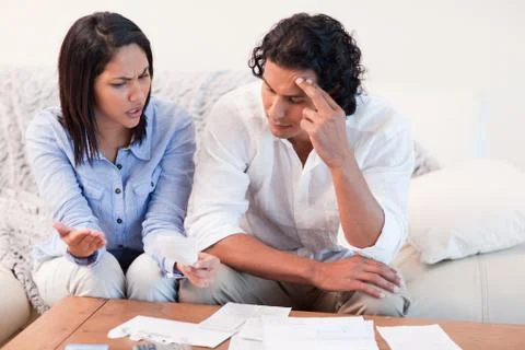 Couple talking about financial problems Stock Photos