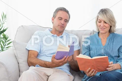 Couple talking about their books Stock Photos