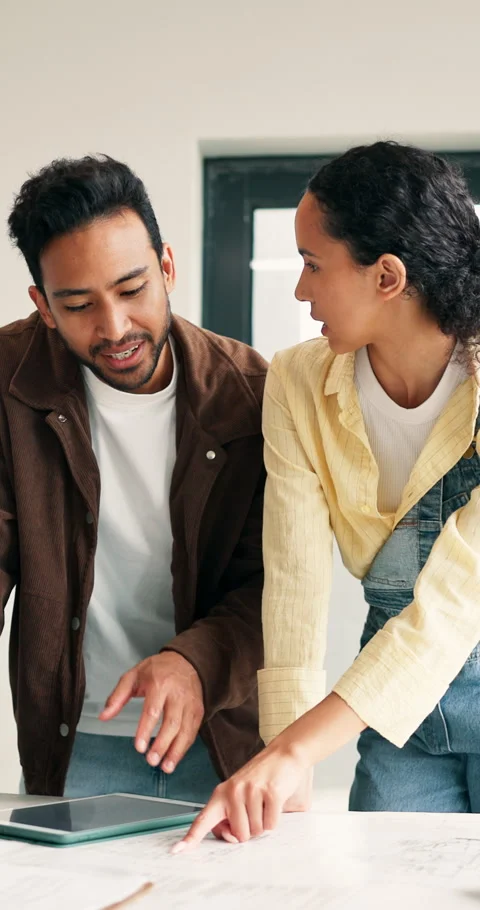 Couple, talking and document in home for renovation, blueprint and interior Stock Footage 340901070