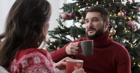 Couple talking and drinking coffee at home Video stock 129424510