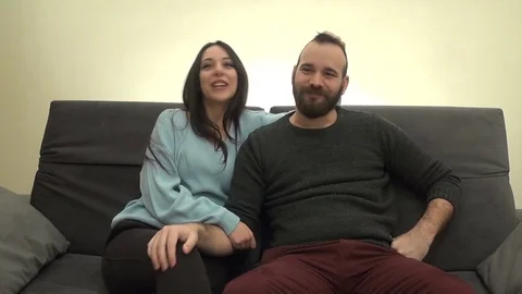 Couple Talking and Laughing on the Couch Vídeos de archivo 74262005