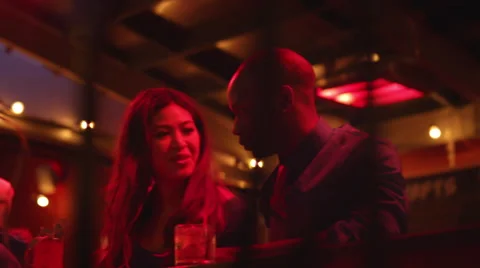 A couple talking and looking at a menu at a bar Vídeo Stock 51785738