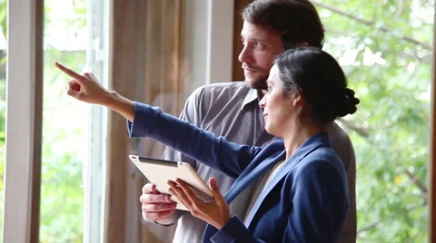 Couple talking and looking out of window Stock Footage 63292949