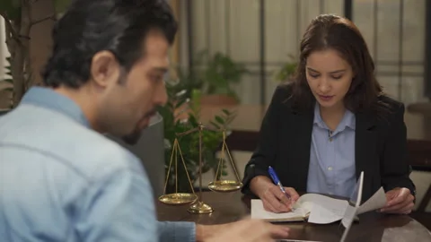 Couple talking and working with laptop computer together in office.  business Stock Footage 168623142