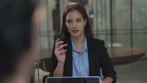 Couple talking and working with laptop computer together in office.  business Stock Footage 168625611