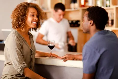 Couple talking in a bar Stock Photos