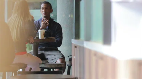 Couple talking in cafe. Animated conversation in slow motion Stock Footage 43590220