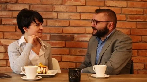 Couple talking in cafe Stock Footage 71814095