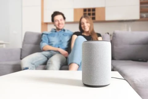 Couple talking command to smart speaker 스톡 사진