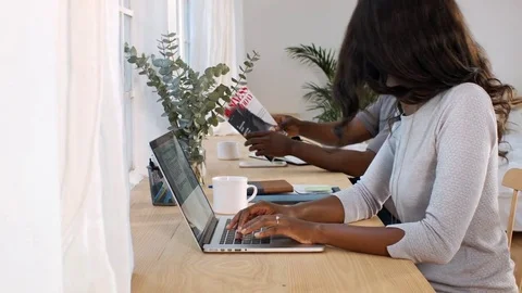 Couple talking discussing plans while woman works from home Stock Footage 77509791
