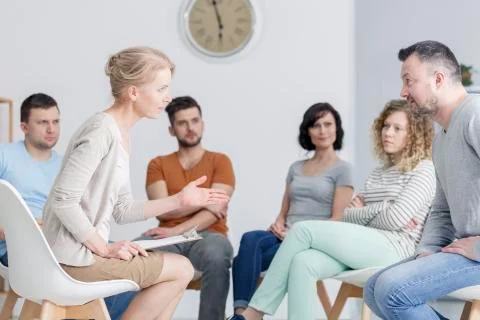 Couple talking during assertiveness training Stock Photos