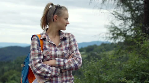 Couple talking with each other and looking on something while standing on the hi Stock-Footage 67577462