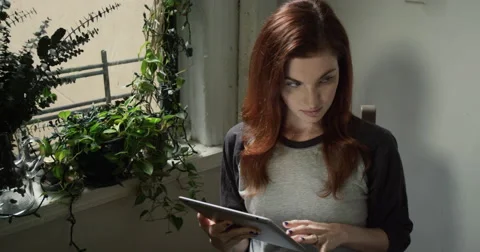 Couple talking to each other while using digital tablet and meal Vídeo Stock 63373878