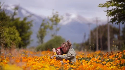 Couple Talking in a Flowers Field Stock Footage 129518512